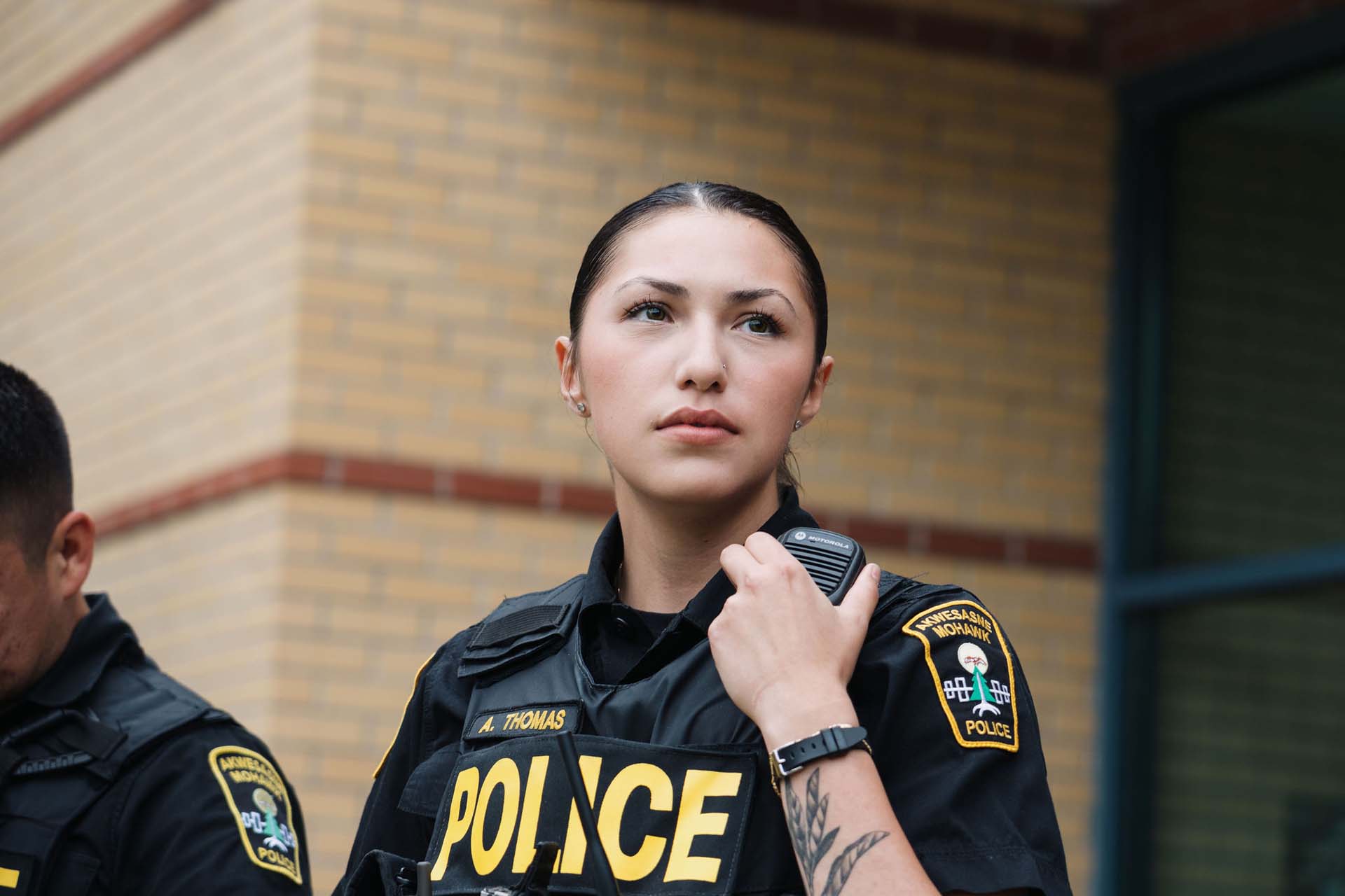 Akwesasne Mohawk police officer listening to radio