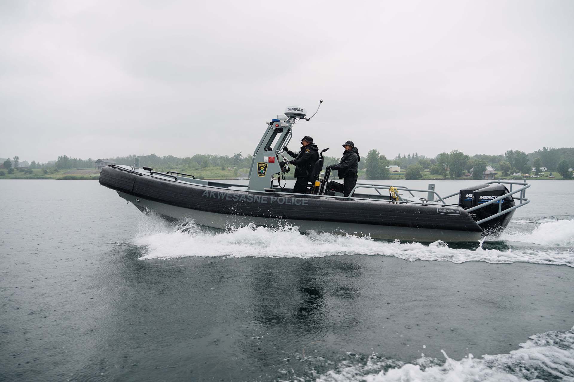 Akwesasne Mohawk police officers on a boat