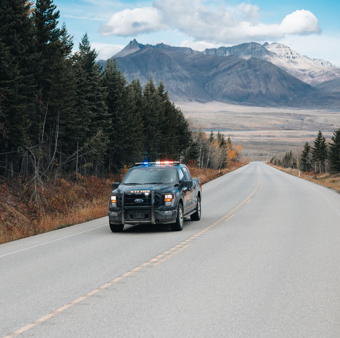 police truck in scenic landscape